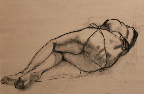 a figure drawing of a girl laying down from the back