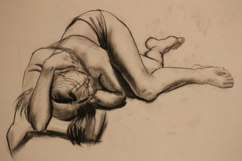 a figure drawing of another girl laying down from the top